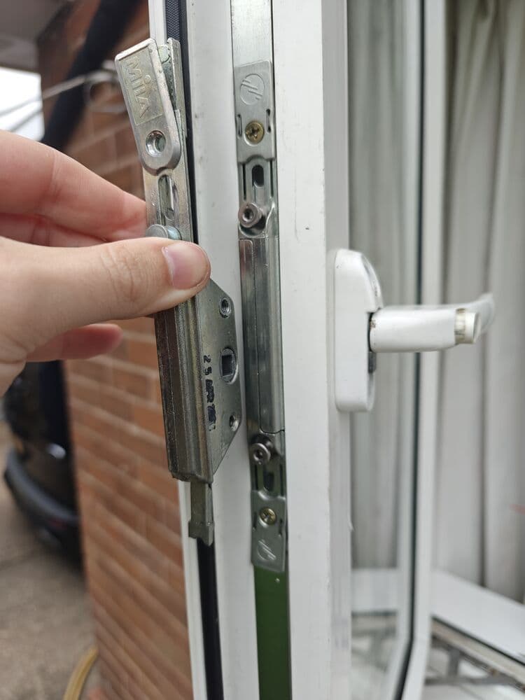 A uPVC door multipoint locking mechanism removed from the door edge